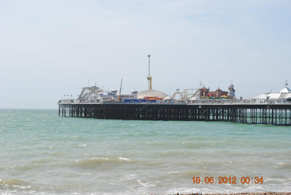 Brighton pier viewed from beach during a weekend in brighton