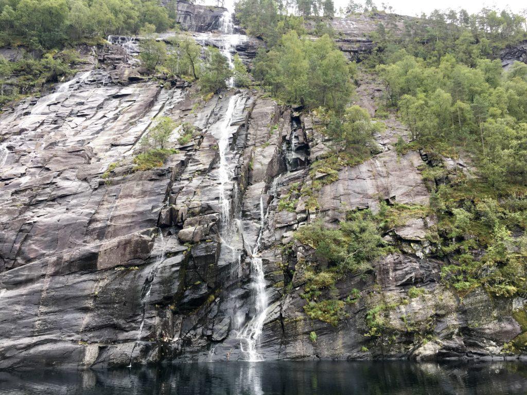 waterfall fjords from a cruise boat from bergen norway