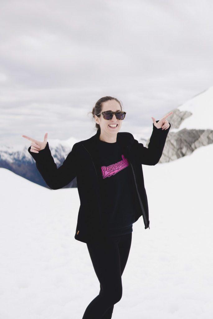 girl on snow landing Scenic Flight over Franz Josef Glacier
