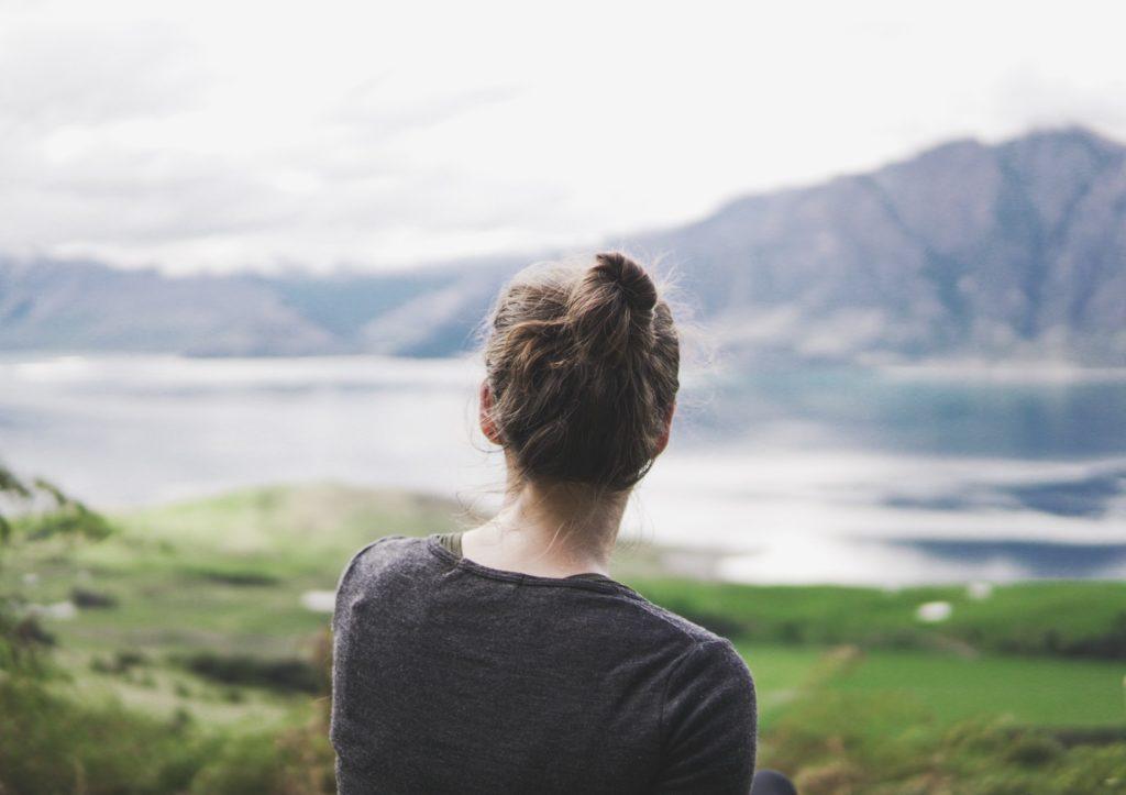 woman looking out at view climbing isthmus peak