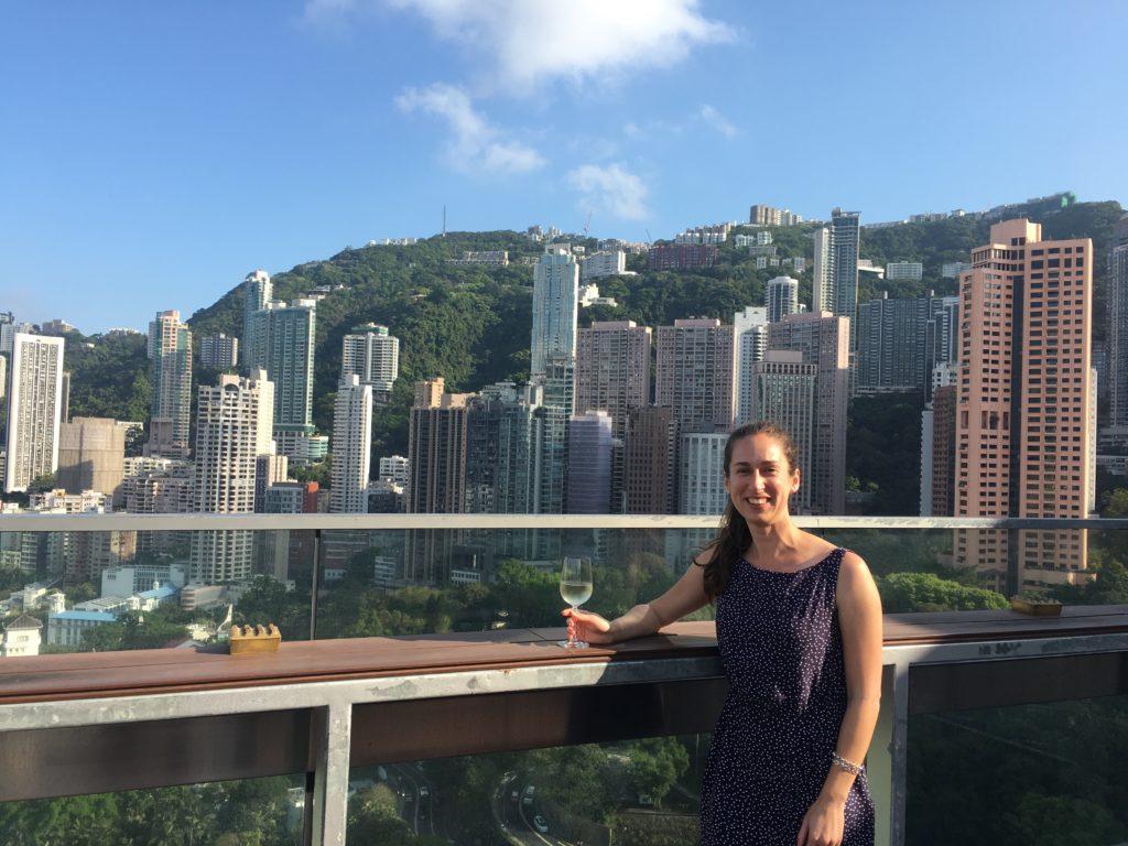 girl with glass of wine skyscraper view c'est la vi Hong Kong Rooftop bar