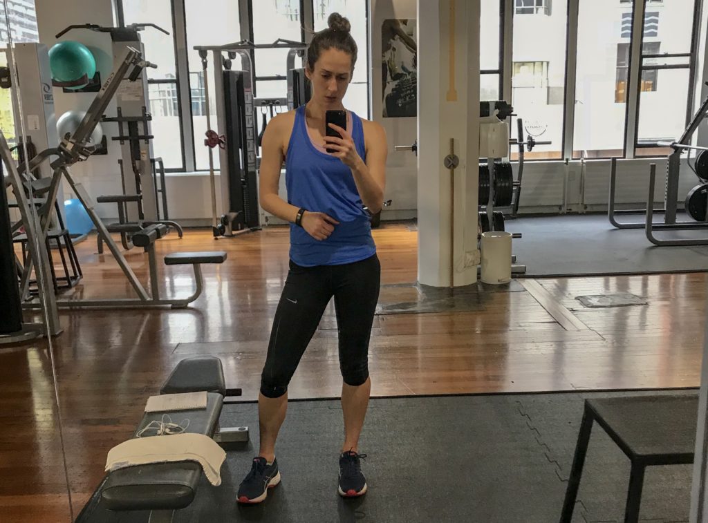 young woman taking mirror selfie in habit gym wellington
