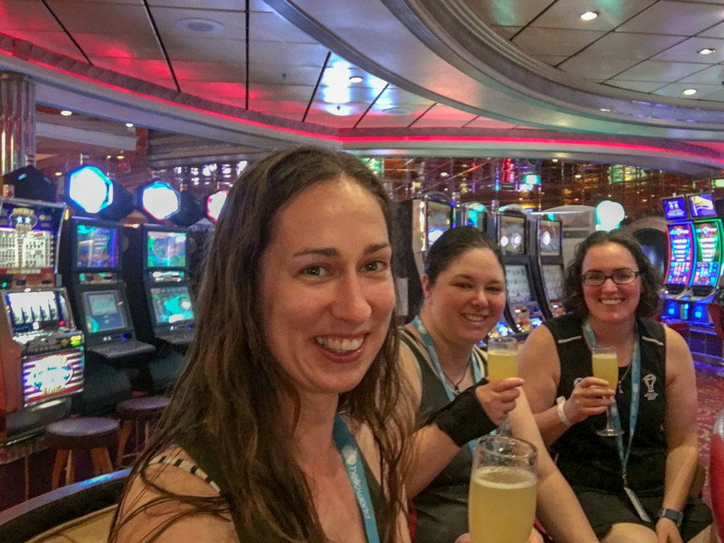 three young women drinking mimosas in a casino
