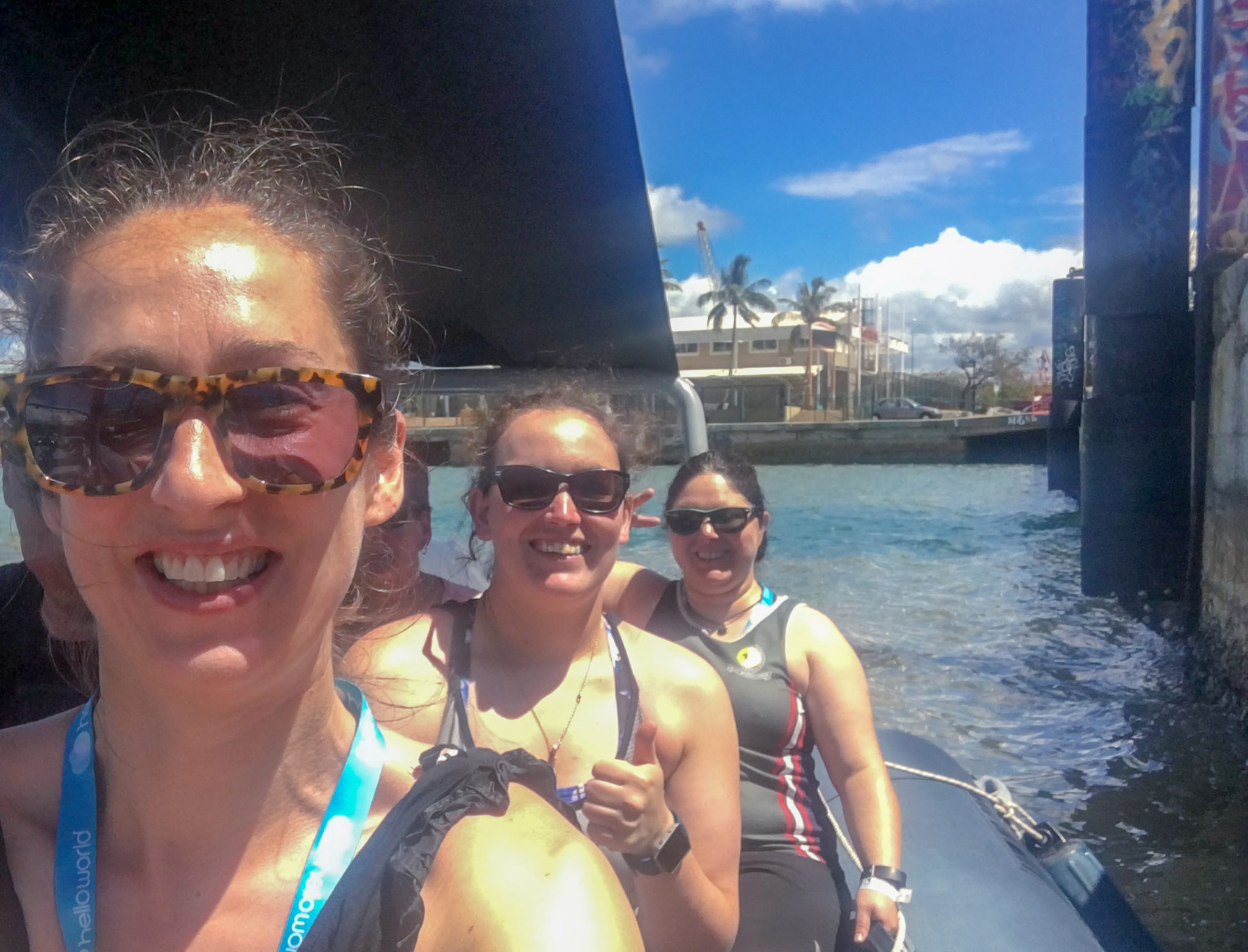 Three young women on a zodiac boat