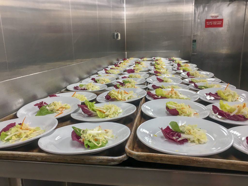 plated entrees in kitchen on a cruise ship