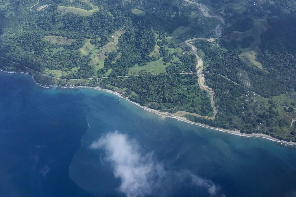 green island, white cloud and blue sea from above