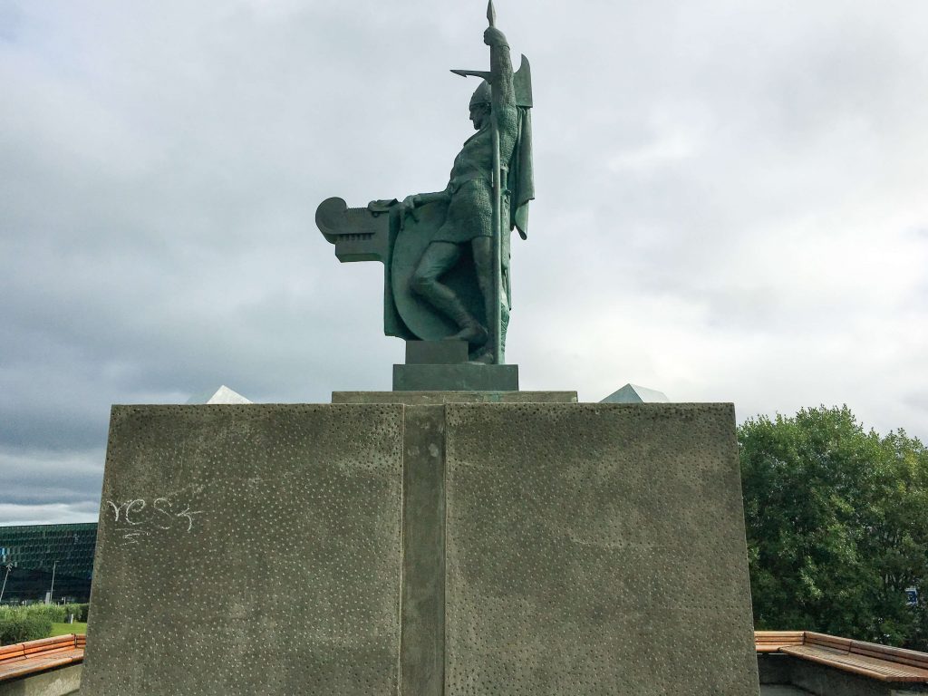 statue of viking holding sword vertically in Reykjavik Iceland