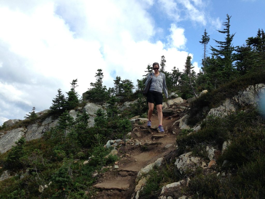 young woman hiking whistler in summer
