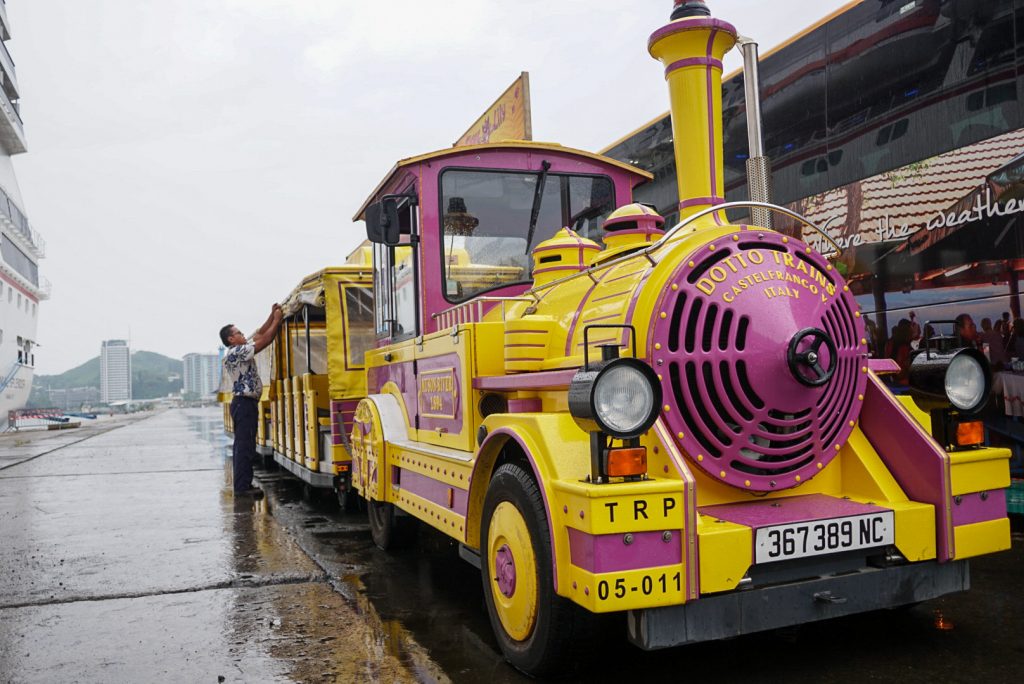 purple tchou tchou train parked at noumea cruise terminal