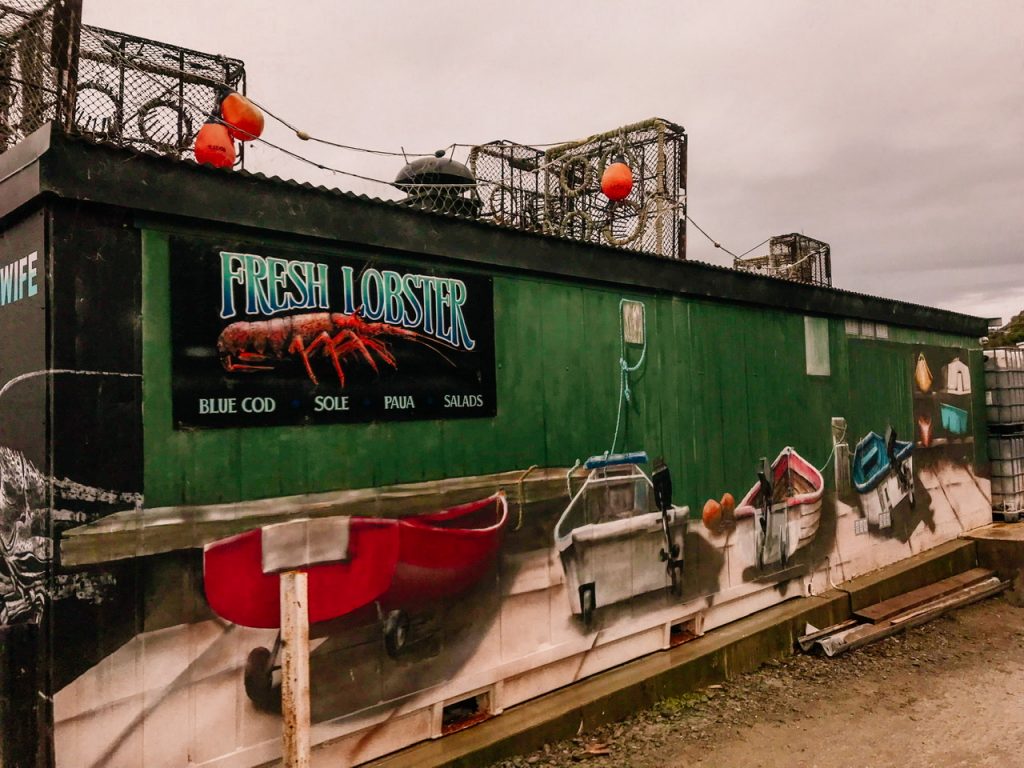 Mural with four boats at Fishwife Moeraki New Zealand