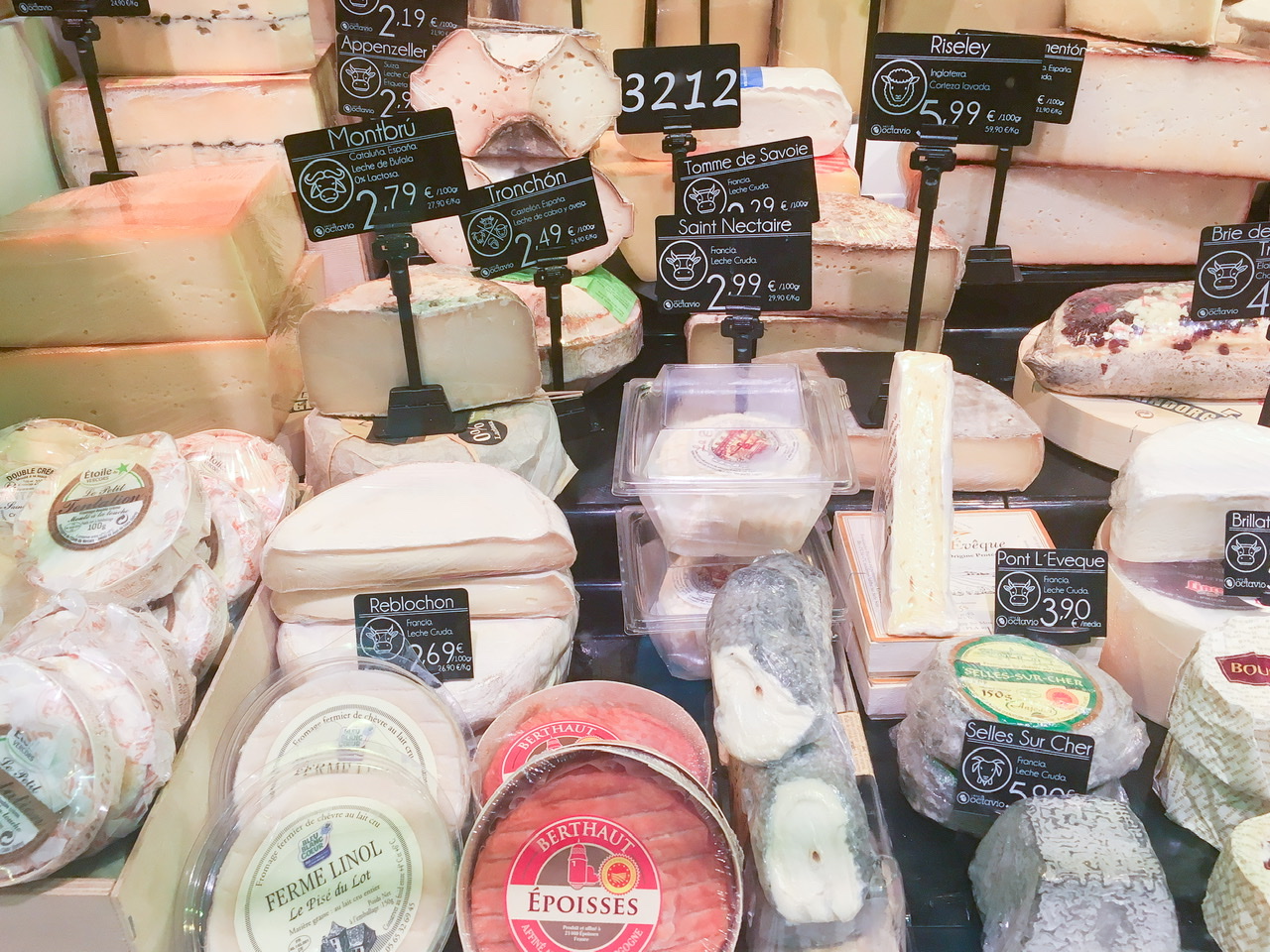 Cheeses on display at San Antón Market in Madrid