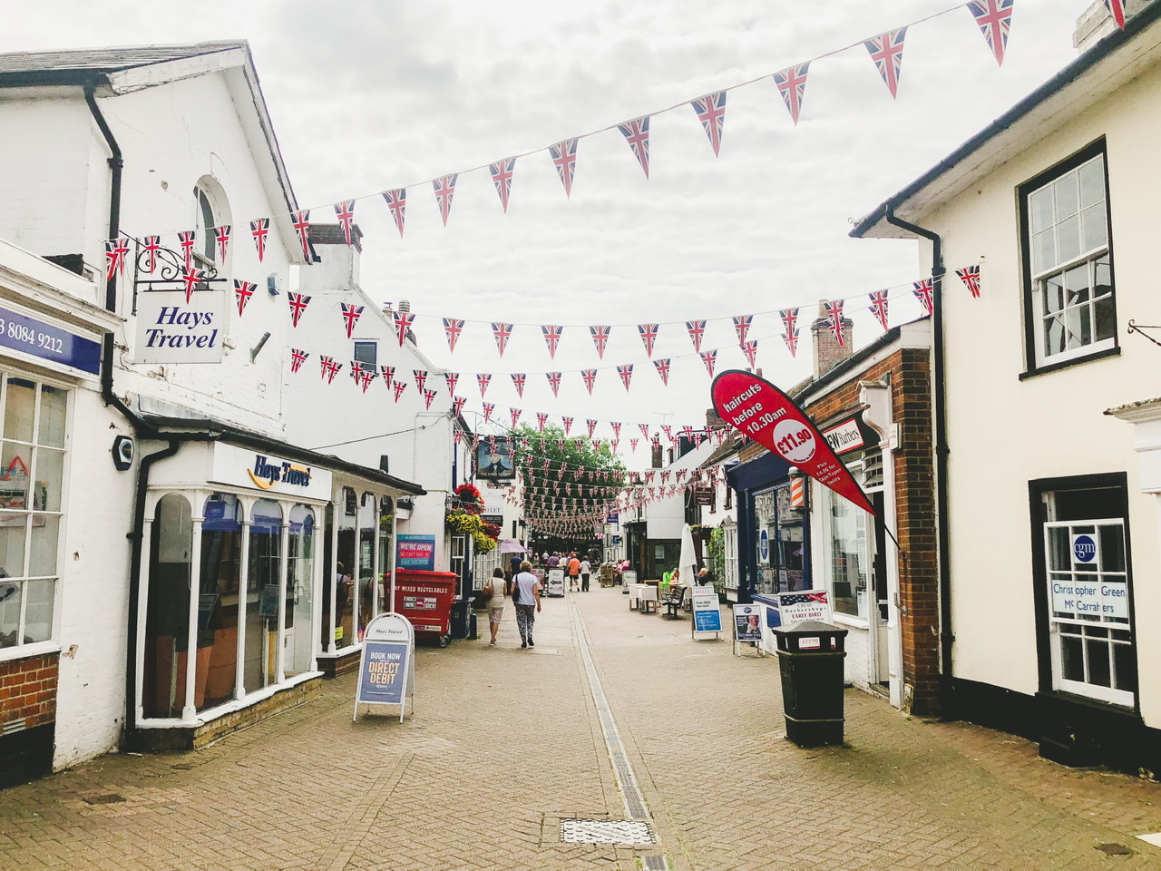 Street in Hythe, Hampshire decorated with triangular bunting printed with the Union Jack