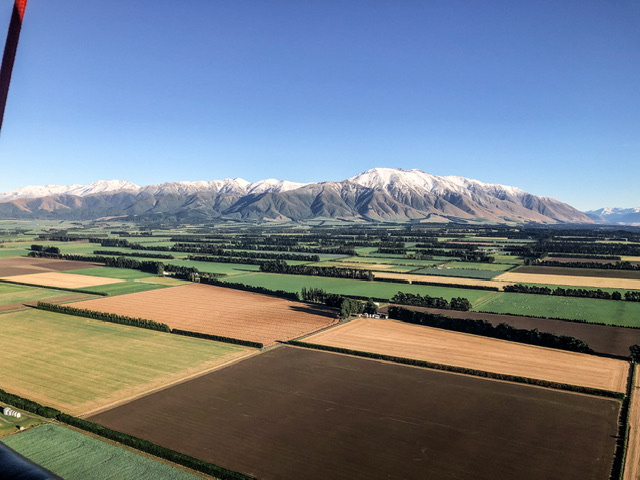 View of Canterbury Plains and snow-capped mountain range from Hot Air Balloon