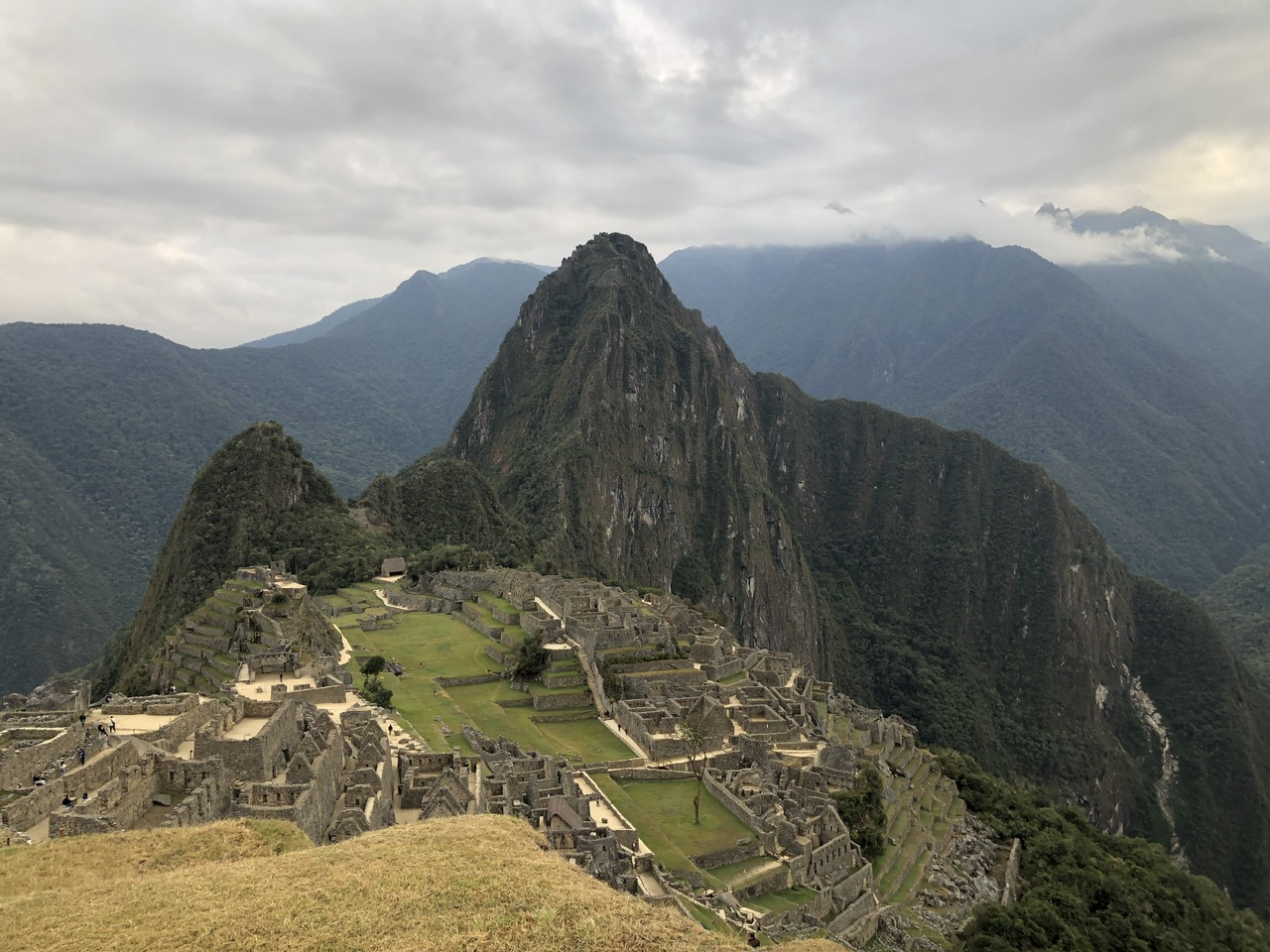 Famous view of Machu Picchu taken around 7am on a clearing morning with Machu Picchu Reservations.