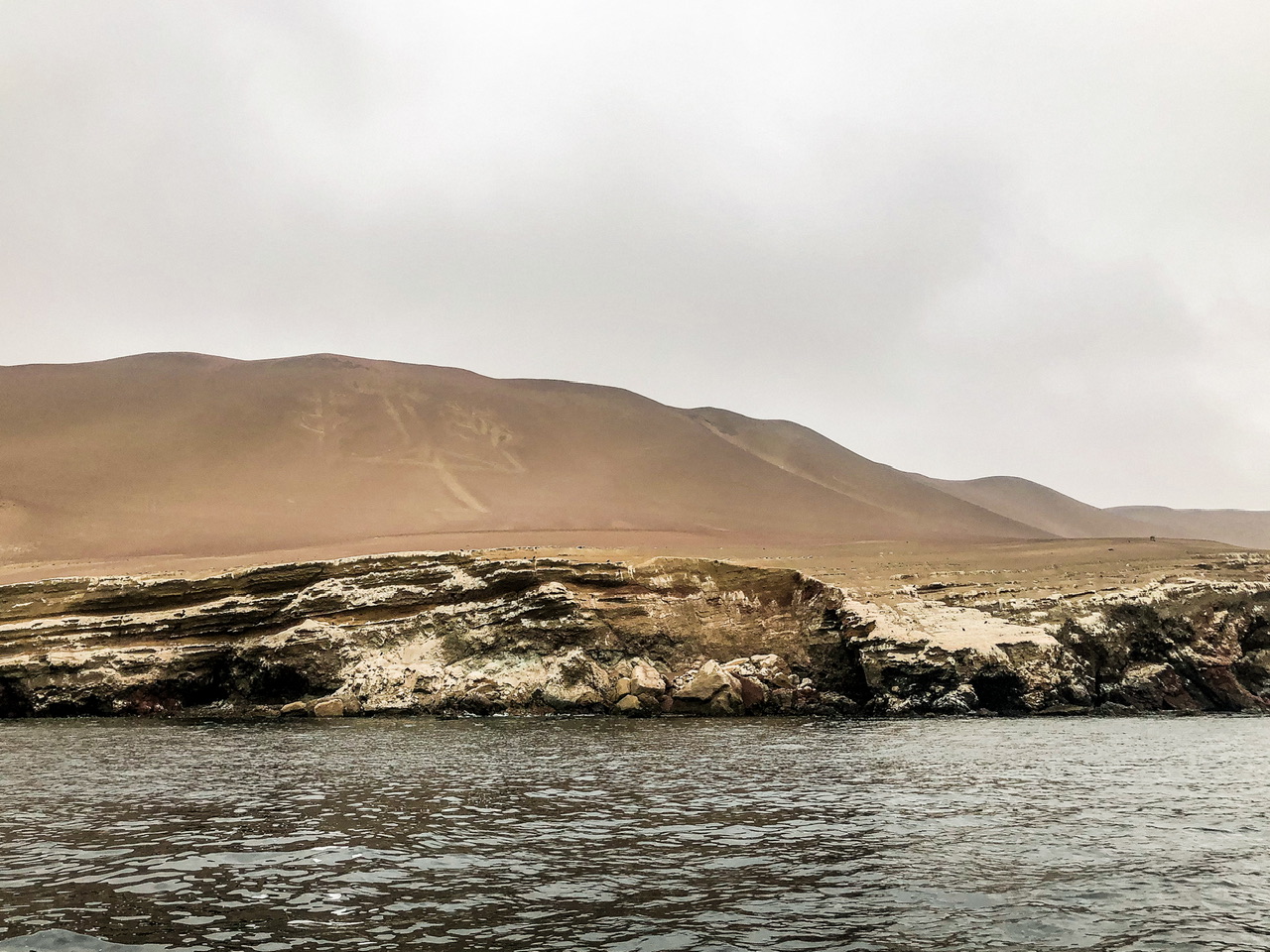 Paracas Candelabra Geoglyph etched in sand on peninsular viewed from the sea.