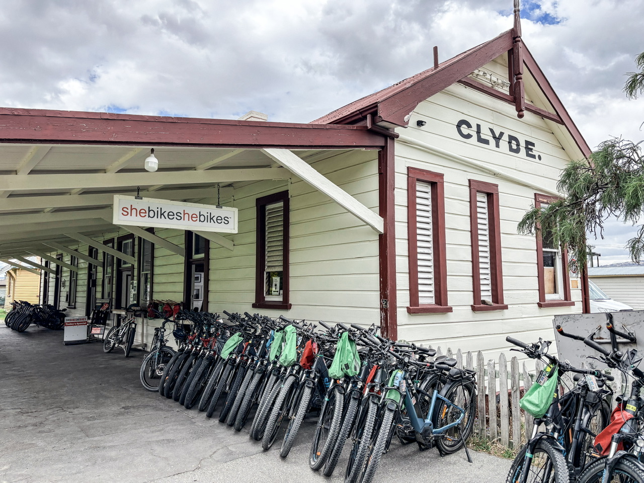 Exterior of She Bikes He Bikes at the old Clyde Railway Station. Over 20 bikes are in the background.