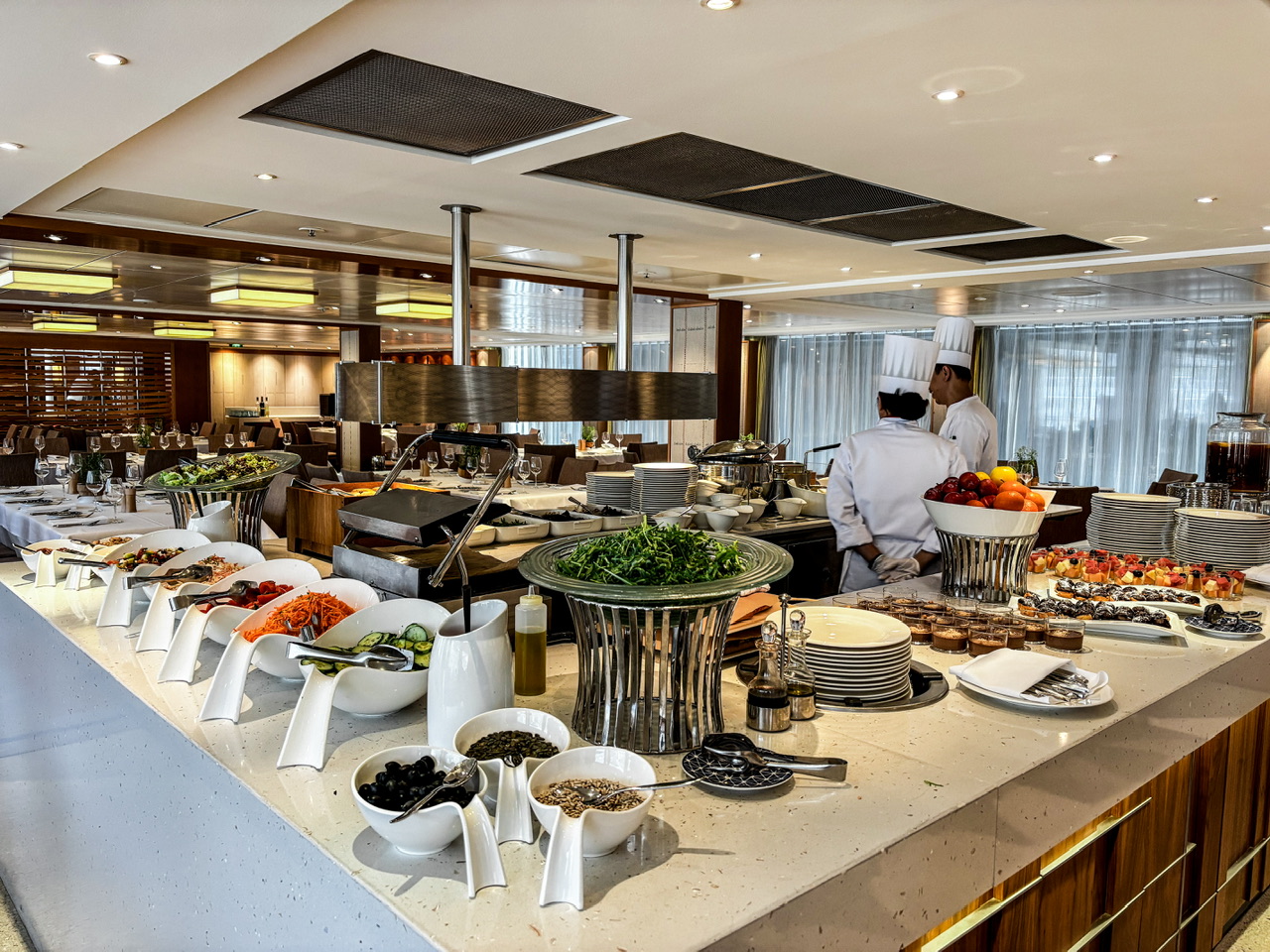 Restaurant area set up with a buffet lunch on a Viking river cruise ship on embarkation day.