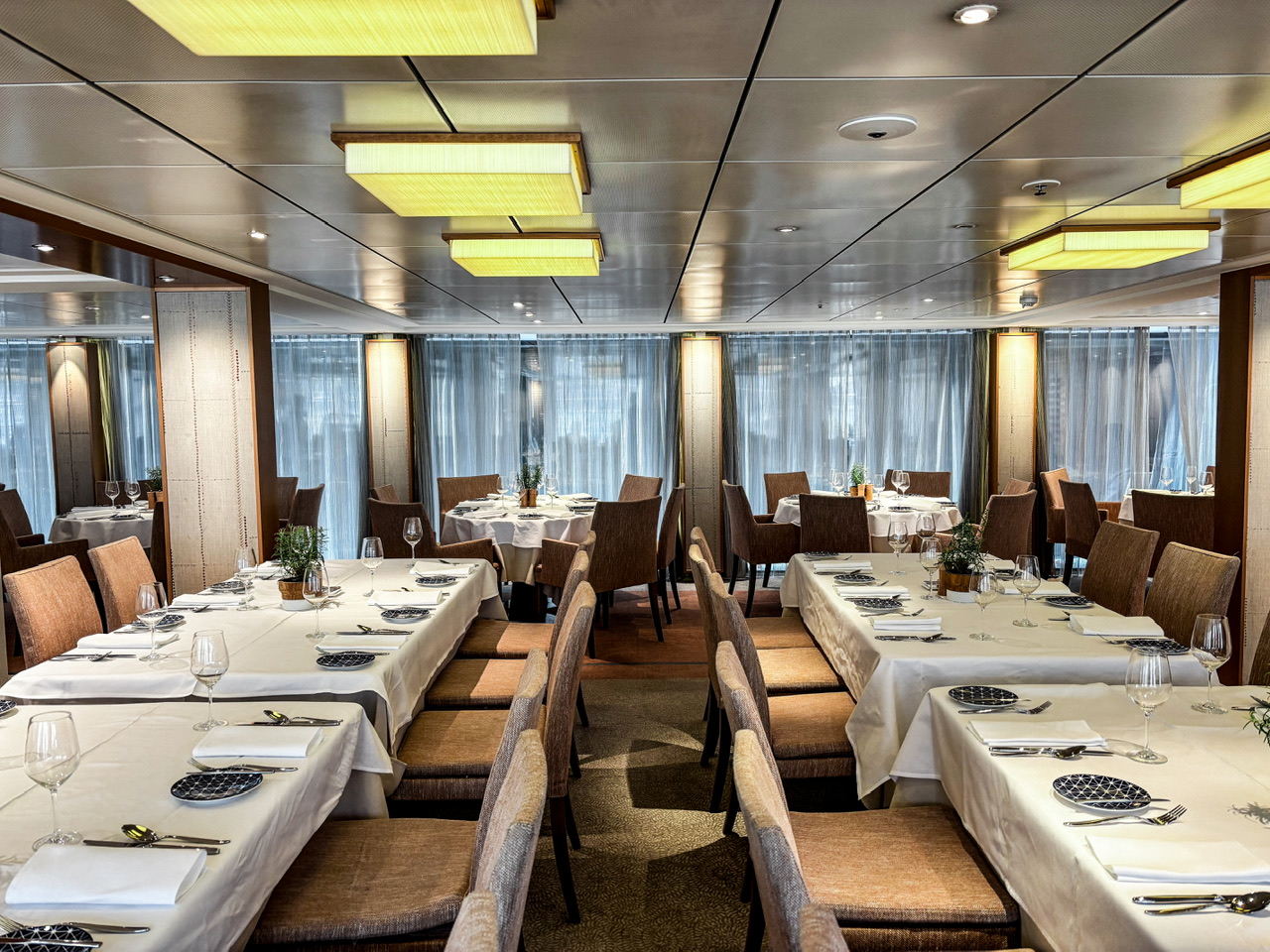 Dining room on Viking Lif with a range of tables set up for a meal.