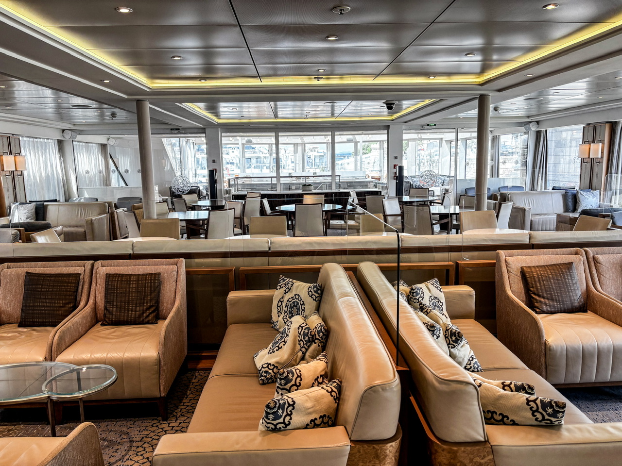 Looking through the lounge area to the Aquavit terrace showing the seating areas on the Viking Lif river cruise ship