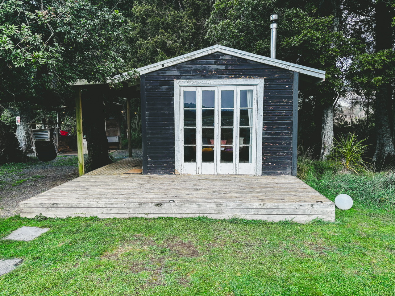 The Musterer's Rest cabin exterior. The black cabin was a former musterer's hut.